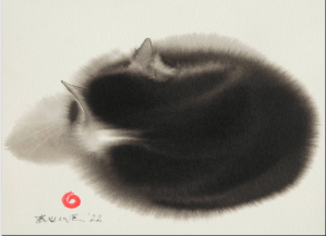 A cat sleeps with its back facing the viewer. 